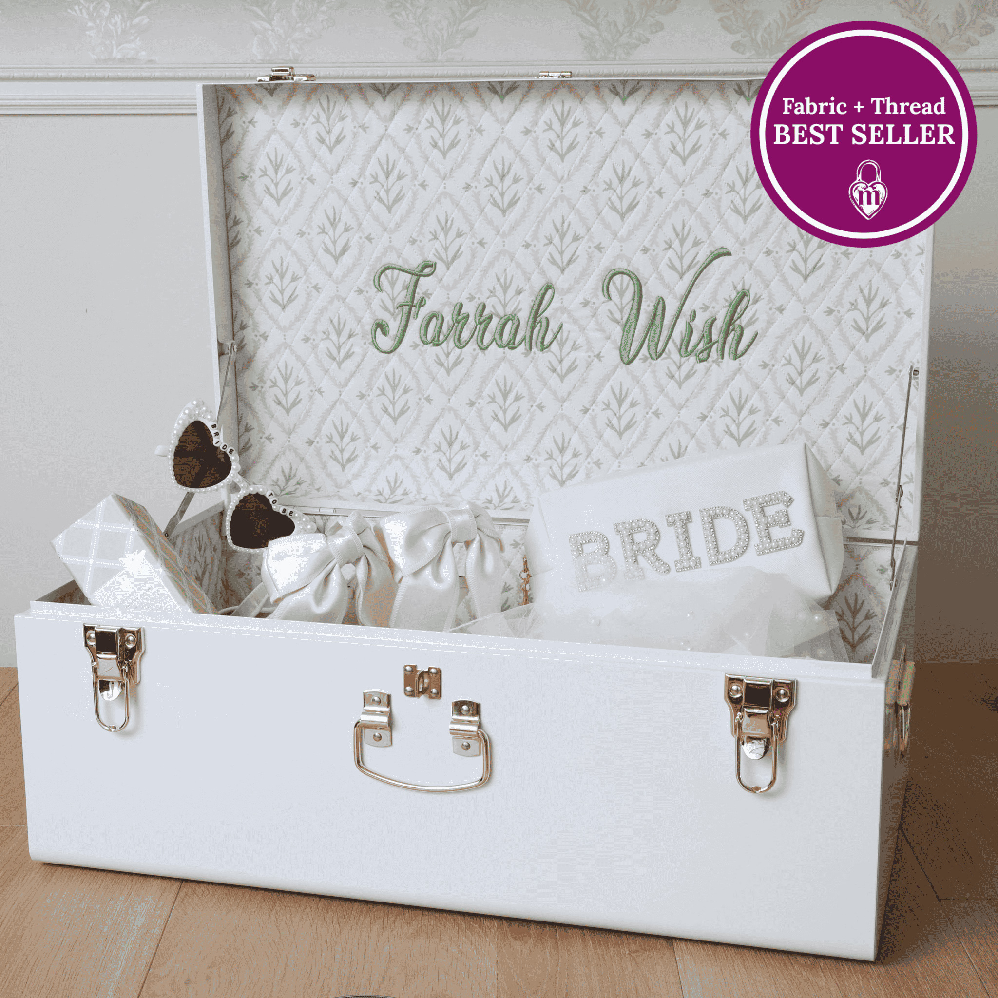 White embroidered trunk with 'Bride' and 'Farrah Wish' text, labeled as a bestseller.